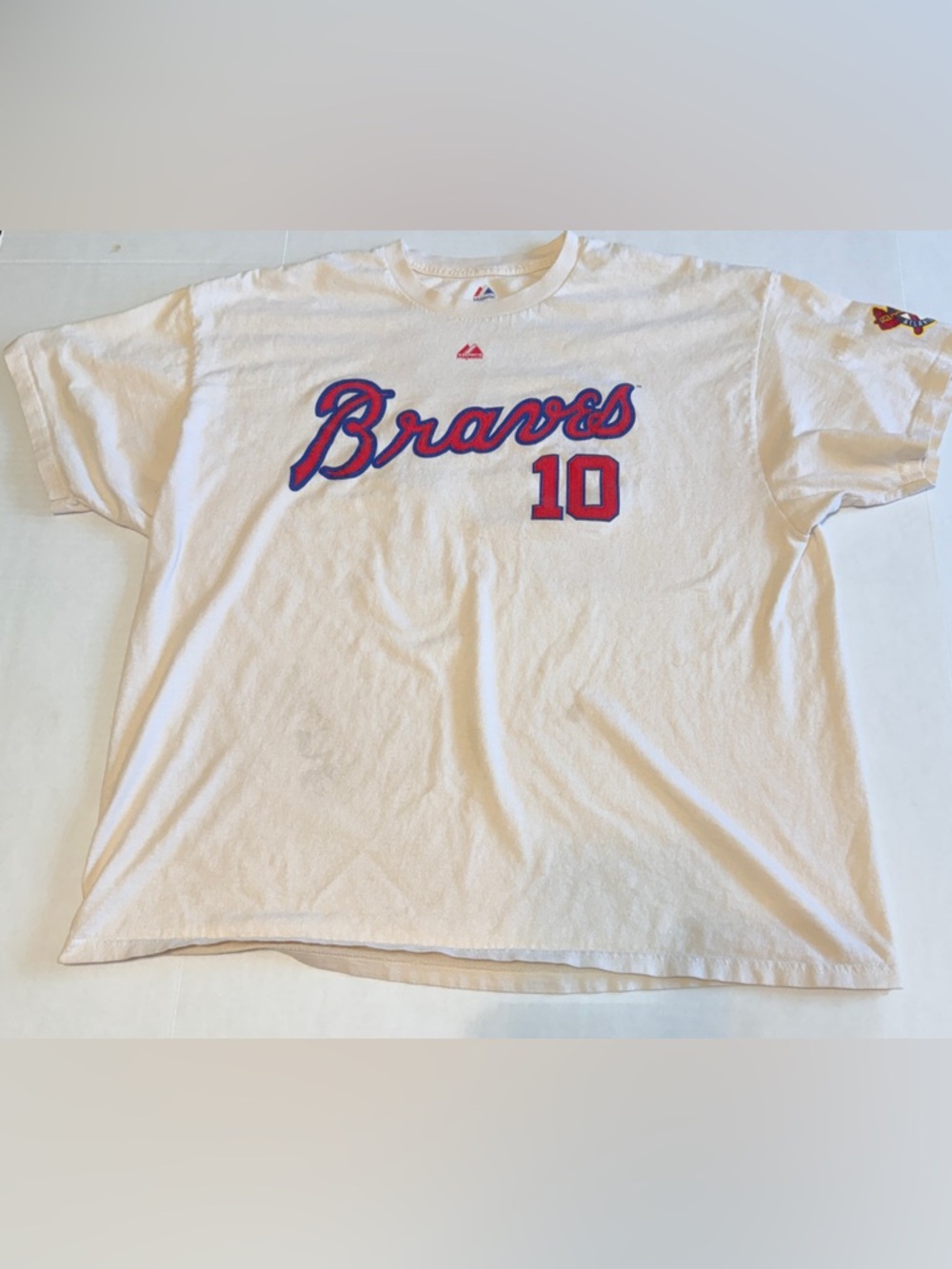 Majestic White Braves Tee with Red & Blue Script and Number 10 Chipper Jones